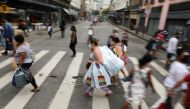 (File picture) People walk in a popular shopping street before Christmas, amid the coronavirus disease (COVID-19) outbreak, in Rio de Janeiro, Brazil, December 23, 2020. REUTERS.