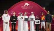 QREC Racing Manager Abdulla Rashid Al Kubaisi with the connection of Mater after the Ahmed Hassan Al Malki Al Jehani-owned four-year-old won the Bu Samrah Cup at Al Rayyan Racecourse, yesterday. 