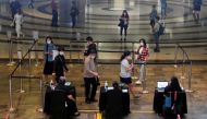 People verify their vaccination statuses as they enter a mall, amid the coronavirus disease (COVID-19) outbreak, in Singapore November 18, 2021. REUTERS/Edgar Su

