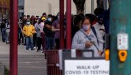People wait outside a community center as long lines continue for individuals trying to be tested for COVID-19 during the outbreak of the coronavirus disease (COVID-19) in San Diego, California, U.S., January 10, 2022. REUTERS/Mike Blake

