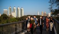 People wearing face masks visit Benjakitti Park amid the coronavirus disease (COVID-19) outbreak in Bangkok, Thailand, January 15, 2022. REUTERS/Athit Perawongmetha

