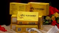 Packs of Chinese traditional herbal medicine Jinhua Qinggan Granules (JHQG) for the treatment of coronavirus (COVID-19) disease are displayed during a ceremony after completion of clinical trial on the efficacy and safety, at the International Centre for Chemical and Biological Sciences of Karachi University in Karachi, Pakistan January 17, 2022. REUTERS/Akhtar Soomro
