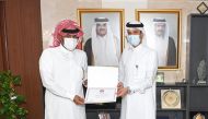 President of the General Authority of Customs Ahmed bin Abdullah Al Jamal presenting the award to GWC Vice Chairman Sheikh Fahad bin Hamad bin Jassem bin Jabor Al Thani, during the event.  