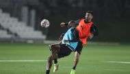 Al Sadd's Abdelkarim Hassan and Boualem Khoukhi during a training session yesterday.