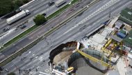 An aerial view shows part of an expressway collapsed above a construction site where Spain's Acciona SA was excavating a tunnel for a new metro line in Sao Paulo, Brazil, February 1, 2022. REUTERS/Carla Carniel
