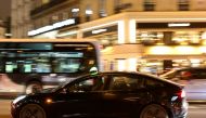 FILE PHOTO: A man drives a Tesla taxi car in Paris, France, December 14, 2021. REUTERS/Sarah Meyssonnier/File Photo
