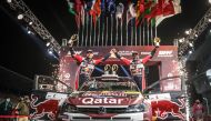 Nasser Saleh Al Attiyah and co-driver Mathieu Baumel celebrate after winning the title.