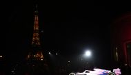 The new Alpine A522 car is seen with the Eiffel Tower during the launch REUTERS/Sarah Meyssonnier

