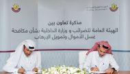 GTA’s Assistant President for Tax Affairs Ghanim bin Khalifa Al Attiyah and Head of Economic and Cyber Crimes Department of the Ministry of Interior Colonel Ali Hassan Al Kubaisi during the signing of memorandum of cooperation.