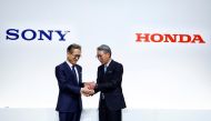 Sony Corp's Chief Executive Kenichiro Yoshida shakes hands with Honda Motor's Toshihiro Mibe attend a joint news conference at Sony's headquarters in Tokyo, Japan, March 4, 2022. REUTERS/Kim Kyung-Hoon