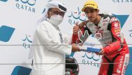 President of Qatar Motor and Motorcycle Federation Abdulrahman Abdulatif Al Mannai presents the runner-up trophy to Hamad Al Sahouti.