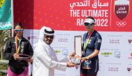 Qatar Olympic Committee (QOC) President, H E Sheikh Joaan bin Hamad Al Thani crowns the winners of the QOC Ultimate Race 2022 at the Cultural Village Katara, yesterday.
