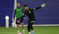 Qatar goalkeeper Saad Al Sheeb in action during a training session, yesterday.