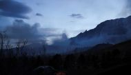 Smoke is seen during a wildfire near the National Center for Atmospheric Research (NCAR) prompted a large evacuation in Boulder, Colorado, U.S. March 26, 2022. REUTERS/Kevin Mohatt
