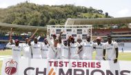 West Indies players celebrate with The Richards-Botham Trophy after winning the third test Action Images via Reuters/Jason Cairnduff
