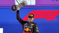 Red Bull's Max Verstappen celebrates on the podium with the trophy after winning the race REUTERS/Hamad I Mohammed
