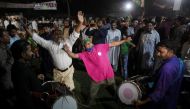 Supporters of the Pakistan Muslim League-Nawaz (PML-N) celebrate after Shehbaz Sharif was sworn in as the country's prime minister, in Lahore, Pakistan April 11, 2022. REUTERS/Mohsin Raza