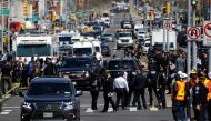 Emergency personnel work at the scene of a shooting at a subway station in the Brooklyn borough of New York City, New York, U.S., April 12, 2022. REUTERS/Eduardo Munoz