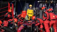 April 10, 2022 Ferrari's Charles Leclerc's pit crew in action during the race Pool via REUTERS/Simon Baker


