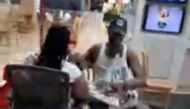 People sit at a shopping mall in the aftermath of a shooting that took place at the mall, in Columbia, South Carolina, April 16, 2022, in this screengrab from a video obtained from social media. SC Lash Extensions via REUTERS