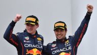 Red Bull's Max Verstappen celebrates on the podium after winning the race alongside second place Red Bull's Sergio Perez REUTERS/Jennifer Lorenzini
