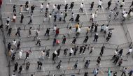 Residents line up at a makeshift nucleic acid testing site during a mass testing for the coronavirus disease (COVID-19) following the outbreak, in Beijing, China April 25, 2022. REUTERS/Tingshu Wang REFILE-QUALITY REPEAT
