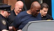 Frank James, the suspect in the Brooklyn subway shooting enters a car outside a police precinct in New York City, New York, U.S., April 13, 2022. REUTERS/Andrew Kelly


