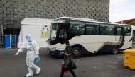 A patient who recovered from the coronavirus disease (COVID-19) leaves the makeshift hospital at the Shanghai World Expo Exhibition and Convention Centre in Shanghai, China May 9, 2022. Picture taken May 9, 2022. China Daily via REUTERS