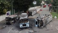 Burnt vehicles of Sri Lanka's ruling party supporters are seen after they were set on fire during a clash of pro and anti-government demonstrators near the Prime Minister's official residence, amid the country's economic crisis, in Colombo, Sri Lanka, May 10, 2022. REUTERS/Dinuka Liyanawatte