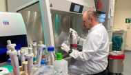 Head of the Institute of Microbiology of the German Armed Forces Roman Woelfel works in his laboraty in Munich, May 20, 2022, after Germany has detected its first case of monkeypox. REUTERS/Christine Uyanik