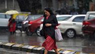  A woman crosses a road as it rains in Mumbai, India, September 20, 2019. Reuters/Hemanshi Kamani/File Photo
 