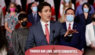Canada's Prime Minister Justin Trudeau, with government officials and gun-control advocates, speaks at a news conference about firearm-control legislation that was tabled today in the House of Commons in Ottawa, Ontario, Canada May 30, 2022. REUTERS/Blair Gable
