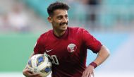 Ahmed Al Ganehi celebrates after scoring Qatar's goal.