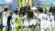 Al Sadd players and officials celebrate with the QNB Stars League trophy in this file photo.