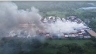 Drone footage shows smoke rising from the spot after a massive fire broke out in an inland container depot at Sitakunda, near the port city Chittagong, Bangladesh, June 5, 2022 in this still image obtained from a handout video. Al Mahmud BS/Handout via REUTERS ATTENTION EDITORS - THIS IMAGE HAS BEEN SUPPLIED BY A THIRD PARTY. MANDATORY CREDIT
