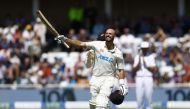 New Zealand's Daryl Mitchell celebrates reaching his century Action Images via Reuters/Andrew Boyers