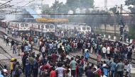 Protestors block railway tracks during a protest against 