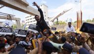 Police stop Indian Youth Congress supporters, as they attempt to cross a barricade during a protest against the Agneepath recruitment scheme on a street in Mumbai, India, June 18, 2022. Reuters/Francis Mascarenhas
 