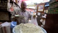 A worker at a herbal store buys flour in Cairo, Egypt. (Reuters/Mohamed Abd El Ghany/File Photo)