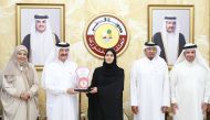 Deputy Speaker of Shura Council H E Dr. Hamda bint Hassan Al Sulaiti receiving the Medal of Arab Woman for Social Responsibility for the year 2022 from Dr. Mohammad bin Saif Al Kuwari, International Ambassador for Social Responsibility.