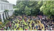 Demonstrators protest inside the President's House, after President Gotabaya Rajapaksa fled, amid the country's economic crisis, in Colombo, Sri Lanka, in this screengrab obtained from social media video on July 9, 2022. (Reuters)