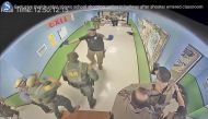In this photo from surveillance video provided by the Uvalde Consolidated Independent School District via the Austin American-Statesman, authorities respond to the shooting at Robb Elementary School in Uvalde, Texas, Tuesday, May 24, 2022.