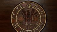  The logo of the State Bank of Pakistan (SBP) is pictured on a reception desk at the head office in Karachi, Pakistan. (REUTERS/Akhtar Soomro/File Photo)