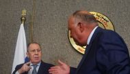 Russian Foreign Minister Sergei Lavrov and his Egyptian counterpart Sameh Shoukry prepare to shake hands during a news conference in Cairo, Egypt, July 24, 2022. REUTERS/Amr Abdallah Dalsh