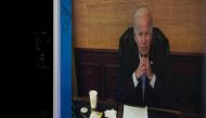 US President Joe Biden, who has coronavirus disease, appears on a screen during a virtual meeting with his economic team at the White House in Washington on July 22, 2022. (REUTERS/Elizabeth Frantz)