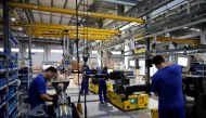 Employees work on the production line of vehicle components during a government-organised media tour to a factory of German engineering group Voith, following the coronavirus disease (COVID-19) outbreak, in Shanghai, China July 21, 2022. REUTERS/Aly Song/File Photo