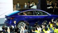 A Tesla China-made Model 3 vehicle owner sits inside a car during a delivery event at Tesla's Shanghai factory in China January 7, 2020. REUTERS/Aly Song


