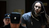US basketball player Brittney Griner is escorted in a court building in Khimki outside Moscow, Russi, August 4, 2022. (Kirill Kudryavtsev/Pool via REUTERS)