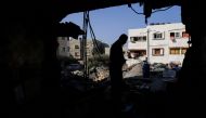A Palestinian checks his house that was damaged during Israel-Gaza fighting in Gaza City August 8, 2022. Reuters/Suhaib Salem