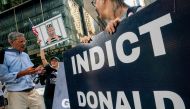 Protestors calling for Trump's arrest rally outside Trump Tower after former US President Donald Trump said that FBI agents raided his Mar-a-Lago Palm Beach home, in New York City, on August 9, 2022. (REUTERS/David 'Dee' Delgado)